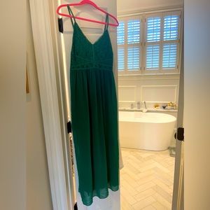 Maxi dress with sheer outer overlay lined with shorter inner skirt.